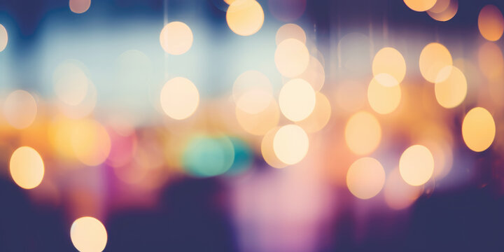 Abstract defocused background with bokeh lights and shadow from cityscape at night in soft blue, pink and yellow colour