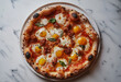 © Thanura - pizza with salami and egg