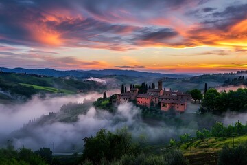 Wall Mural - A gentle mist rolling over a hillside village as the dawn spreads its colors across the sky