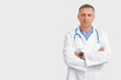 © Pixel-Shot - Mature doctor on white background