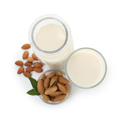 Canvas Print - Glass of almond milk, jug and almonds isolated on white, top view