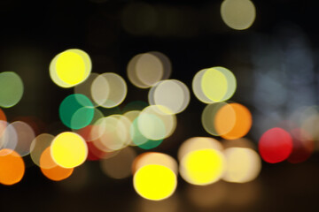 Wall Mural - blurry background image of defocused colorful abstract city street lights at night
