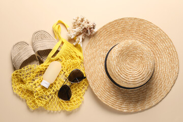 Poster - String bag and different beach accessories on beige background, top view