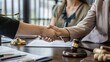© The Little Hut - Woman lawyer hand and women client shaking hand collaborate on working agreements with contract documents at the modern office : Generative AI