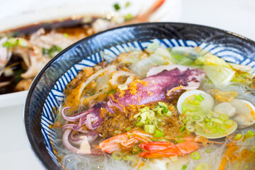 Sticker - Seafood soup noodles bowl in the restaurant