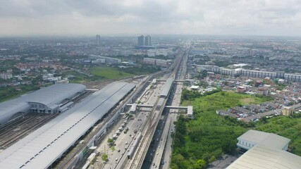 Sticker - Aerial view of Bangkok Railway terminal station, BTS with skyscraper buildings in urban city, Bangkok downtown skyline, Thailand. Cars on traffic street road on highways.