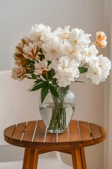 Wall Mural - White flowers in a vase on a wooden table.