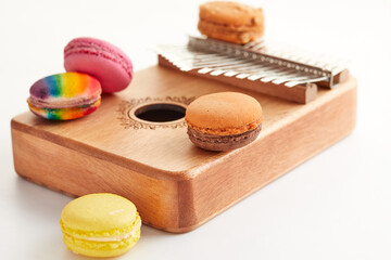 Wall Mural - Colorful Macarons on Wooden Musical Instrument