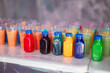 © Ольга Апанасенко - Lots of plastic cups with multicolored liquid paint for the paint shooting game. Children's entertainment