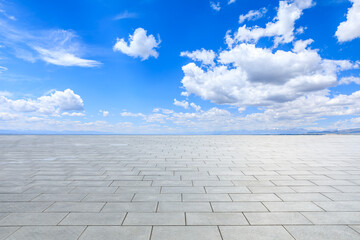 Wall Mural - Empty square floor and sky clouds nature background on a sunny day