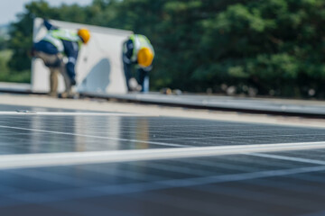 Wall Mural - worker technicians are working to construct solar panels system on roof. installing solar photovolta