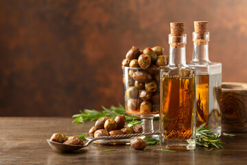 Canvas Print - Bottles of olive oil and spicy olives.