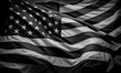 © Artfinity - A black and white American flag waving on a black background. Flag of USA.