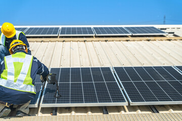 Wall Mural - worker technicians are working to construct solar panels system on roof with sky and clound on backg