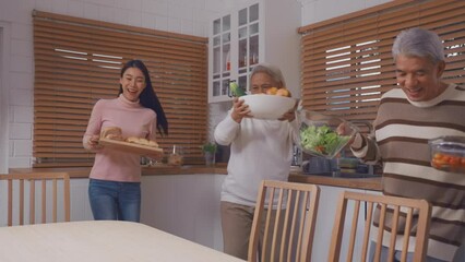 Wall Mural - Asian lovely family having dinner enjoy eating party in house together. 