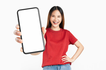 Wall Mural - Beautiful Asian woman holding smartphone mockup of blank screen and smiling on white background.