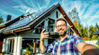 © OLHA - Man taking selfie in front of house with solar panel on the roof.