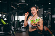 © Quality Stock Arts - Healthy women in Fitness Gym Body Care by Eating Vegetable and weight Training in Sport Club.