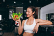 © Quality Stock Arts - Healthy women in Fitness Gym Body Care by Eating Vegetable and weight Training in Sport Club.