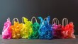 © Dinaaf - plastic bag with a white string handle, each filled with different colors of transparent rainbow colored bags on a table