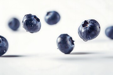 Wall Mural - Close up narutal fresh blueberry slices falling and floating in air isolated on white background