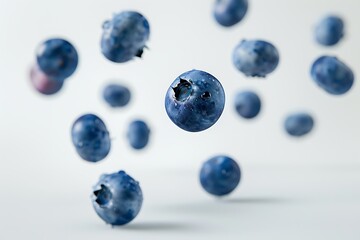 Wall Mural - Close up narutal fresh blueberry slices falling and floating in air isolated on white background