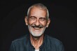 © alisaaa - Portrait of a smiling senior man Close up of a laughing senior man against black background. Portrait of smiling senior man looking down