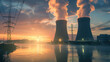 © 沈军 贡 - Nuclear power plant with two towers, glowing in the dusk light near river and highvoltage lines
