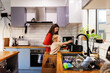© Austockphoto - mother and young son cooking together in kitchen doing dinner prep