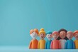 © Tackey - Colorful clay figures of people standing together against a blue background, symbolizing diversity and community. 3D Illustration.