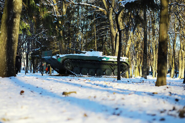 Snow-Covered Military Tank in Winter Forest Park Scenic Landscape