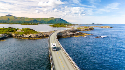 Wall Mural - An RV drives along the Atlantic Road Bridge in Norway, a scenic bridge that connects several islands.