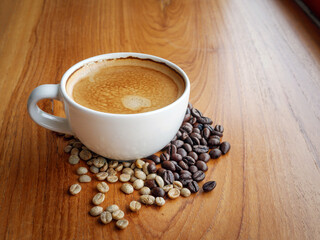 Wall Mural - Espresso cup  coffee and coffee bean on wooden table in morning