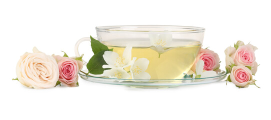 Poster - Aromatic herbal tea in glass cup and flowers isolated on white