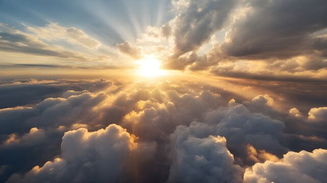 A breathtaking aerial view of the sun peeking through the fluffy white clouds.