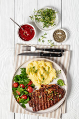 Wall Mural - grilled pork steak with mashed potato and salad