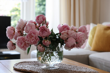 Wall Mural - Beautiful pink peonies in vase on table at home. Interior design