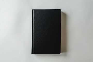 Minimalist black notebook on a white background simple and professional plenty of room for text