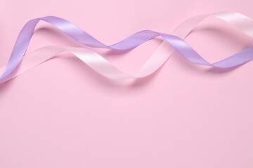 Wall Mural - Beautiful ribbons in different colors on pink background, flat lay