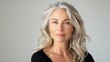 © Photolife   - portrait of a beautiful middle-aged Caucasian woman with blond long hair, well-groomed facial skin, studio portrait white background.