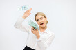 © wedmoments.stock - Happy blonde businesswoman against a white studio background rejoices at the arrival of money. The concept of good news, money coming in and a successful career.