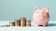 © Joyce - Pink piggy bank with coin on table