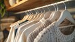 © Vodkaz - Dress for Success A minimalist wardrobe featuring blank hangers serves as a reminder for professionals to prioritize a versatile wardrobe, promoting cost-effective style