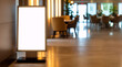 © All Creative Lines - Blank smart kiosk mockup standing in a modern office building. Empty template of touch screen, self-service in modern hallway.