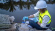 © reewungjunerr - Environmental engineers inspect water quality,Bring water to the lab for testing,Check the mineral content in water and soil,Check for contaminants in water sources.