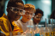 © Iryna - Children in science class wearing safety goggles, focusing on experiments with beakers and test tubes on the table