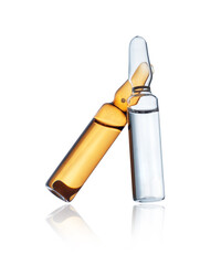 Wall Mural - Transparent and yellow of medical ampoules close up isolated on a white background