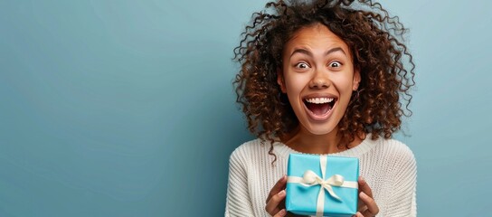 Excited Young Woman Holding a Gift