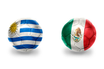 Wall Mural - football balls with national flags of uruguay and mexico ,soccer teams. on the white background.