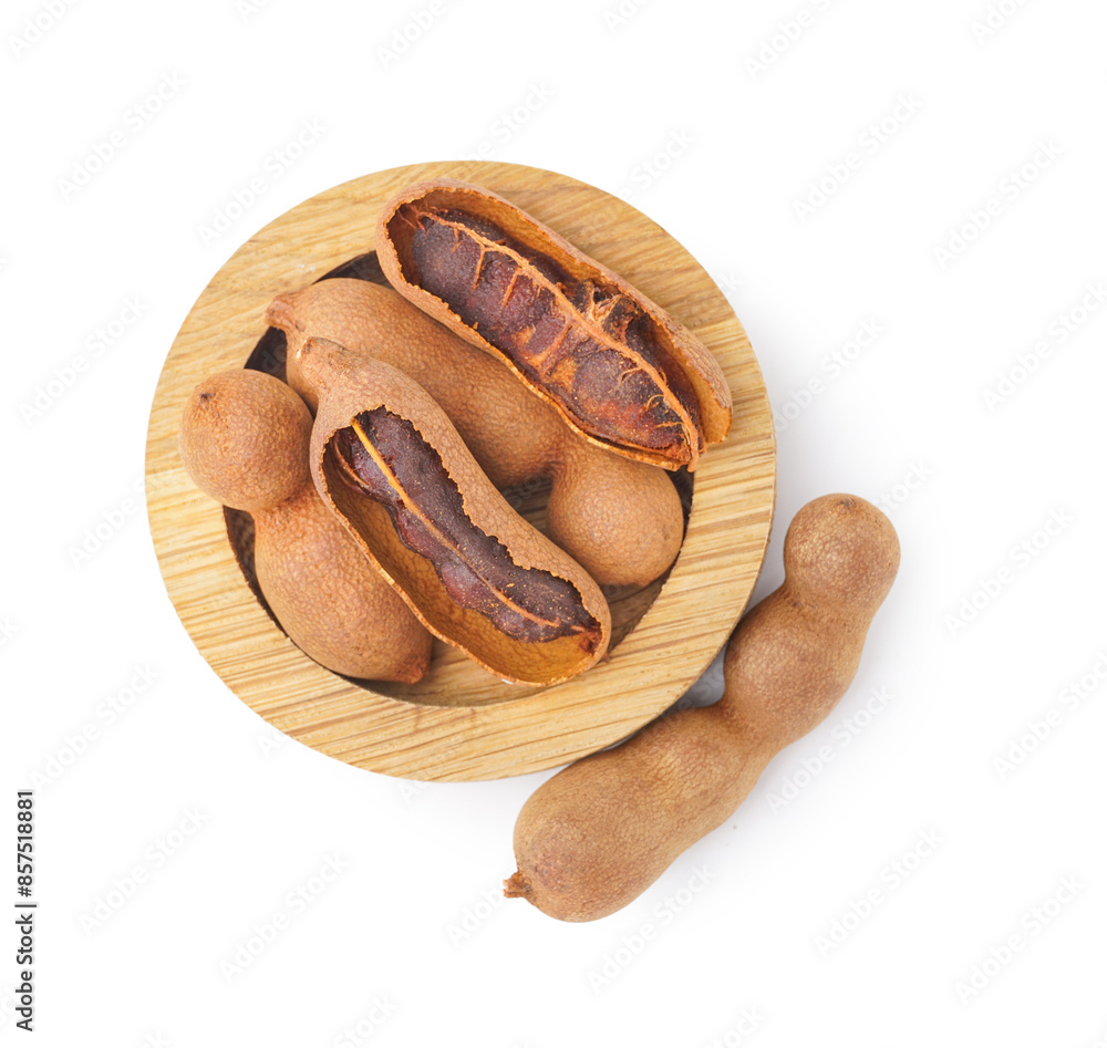 Bowl of tasty tamarinds on white background
